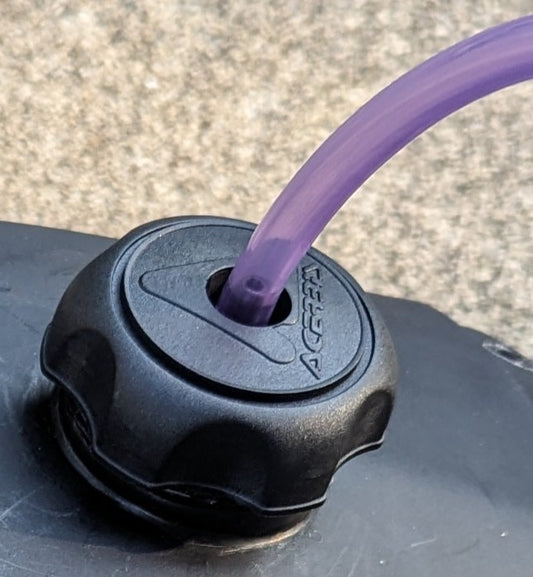 Fuel cap with hose
